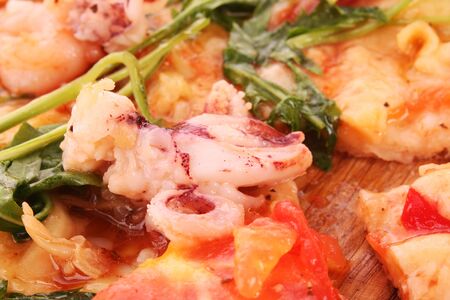 Pizza closeup isolated on whiteの写真素材