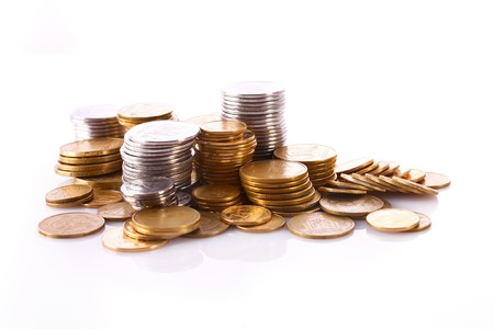 Many coins in column isolated on white