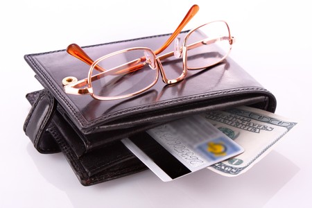 Purse, glasses and credit cards isolated on whiteの写真素材