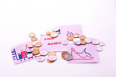Notes with earn money symbols and chartsの写真素材