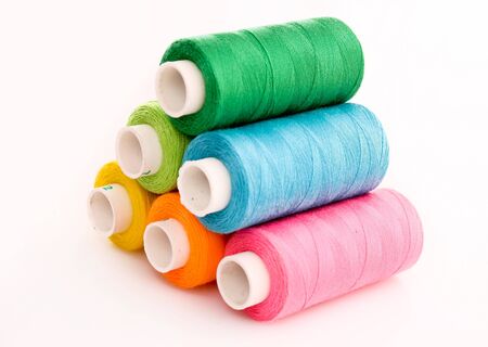 Few bobbins isolated on white