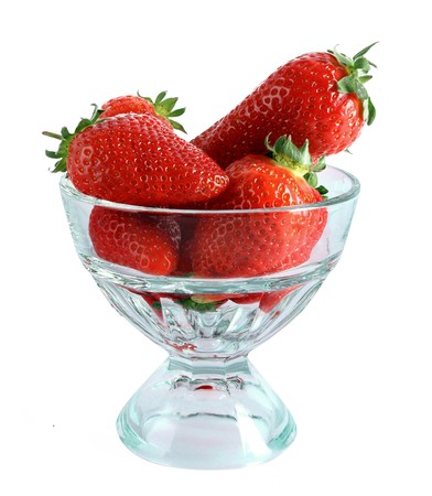Few strawberries in glass cup isolated on whiteの写真素材