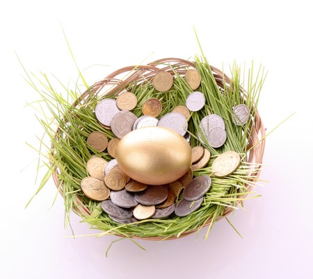 Gold  egg in nest. Ukrainian coinsの写真素材