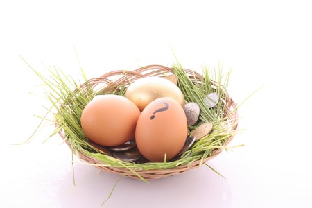Gold  egg in nest. Ukrainian coinsの写真素材