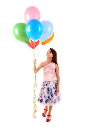 Little girl with balloons isolated on whiteの写真素材