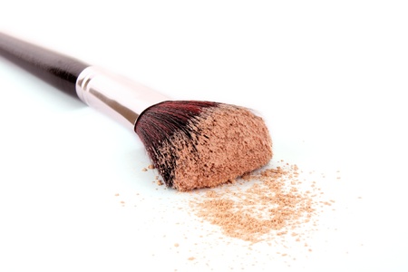 cosmetic brush and powder isolated on white