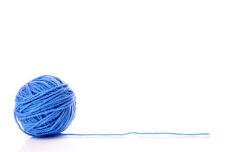 Blue ball of woollen thread isolated on whiteの写真素材