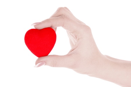 red heart in hand isolated on whiteの写真素材