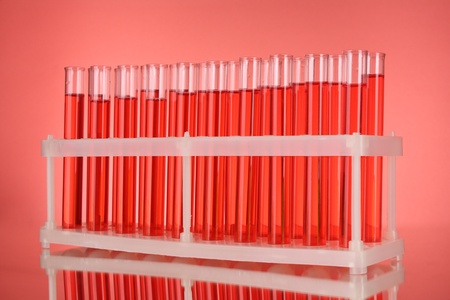 Test-tubes on red backgroundの写真素材