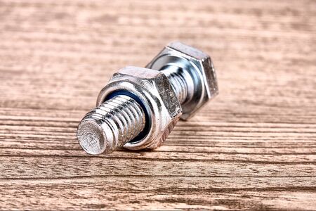 Bolt and screw on wooden table