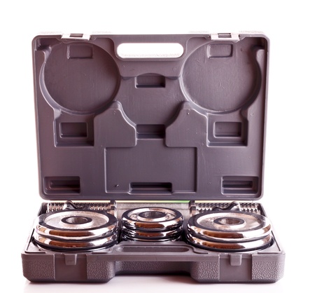 Disassembled dumbbells in box isolated on whiteの写真素材