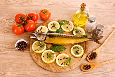 Mackerel with lemon, tomato, oil and pepperの写真素材