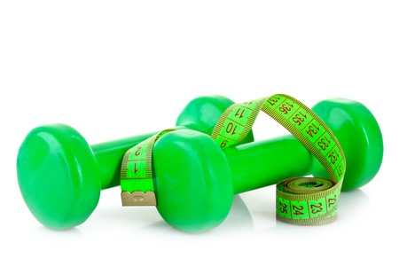 Dumbbells and measuring tape  isolated on whiteの写真素材