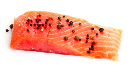 Red fish with pepper  isolated on whiteの写真素材