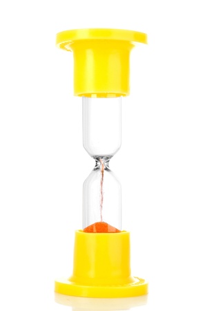 Yellow hourglass isolated on whiteの写真素材
