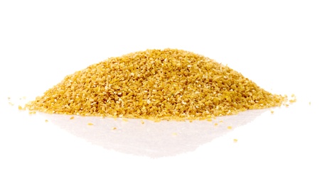 Fine-ground barley in pile isolated on whiteの写真素材