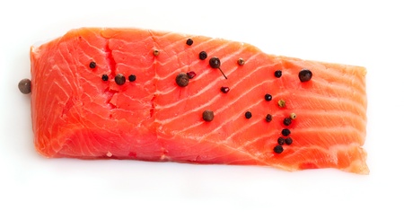 Red fish with pepper  isolated on white
