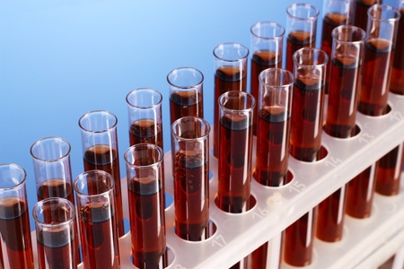 Test tubes closeup on blue backgroundの写真素材