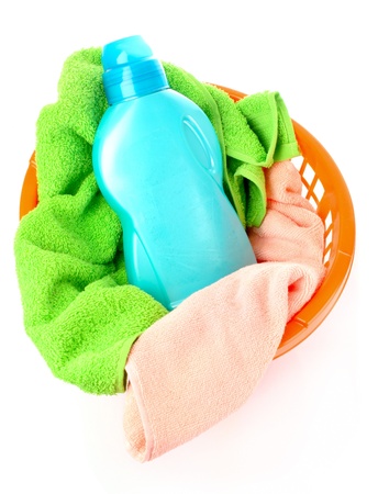 Detergents and towels in basket isolated on whiteの写真素材