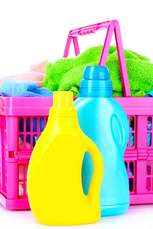 Detergents and towels in basket isolated on whiteの写真素材