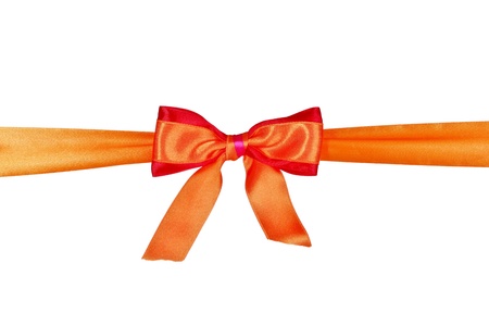 Orange  ribbon and bow isolated on white backgroundの写真素材