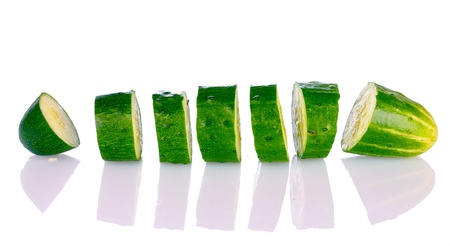 Sliced cucumber isolated on whiteの写真素材