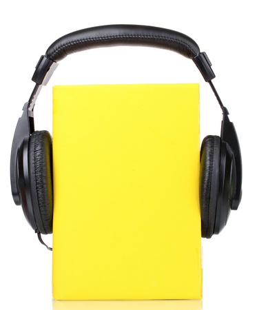 Headphones on book isolated on whiteの写真素材