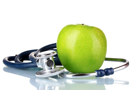 Medical stethoscope and apple isolated on whiteの写真素材