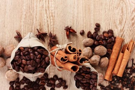 cinnamon, coffee, nutmeg and on wooden backgroundの写真素材