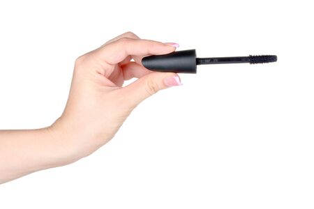 Woman\'s hand and mascara isolated on whiteの写真素材