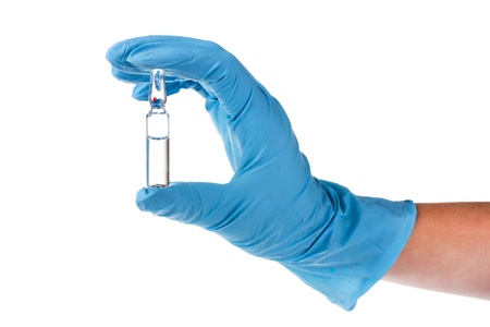 hands and ampoule isolated on white