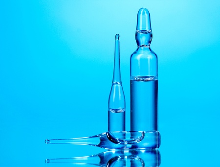 medical ampoules on blue backgroundの写真素材