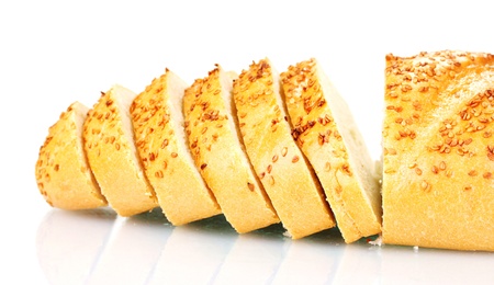 tasty sliced bread with sesame seeds isolated on white