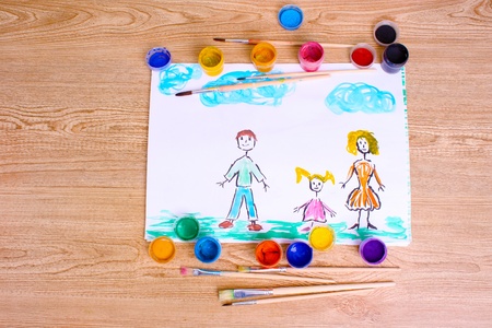 children's drawings and paint on wooden backgroundの写真素材