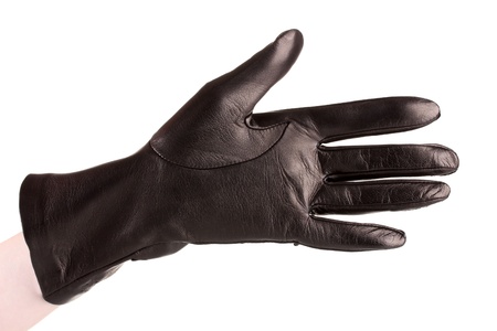 women hand in black leather glove isolated on whiteの写真素材
