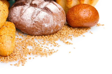 delicious breads and wheat isolated on whiteの写真素材