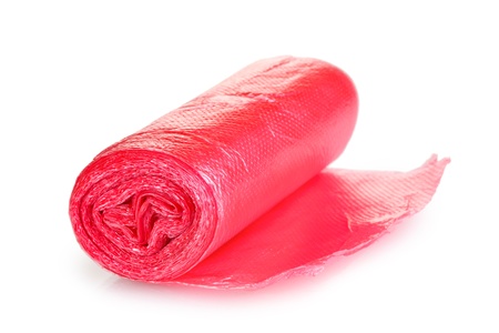 Roll of red garbage bags isolated on whiteの写真素材