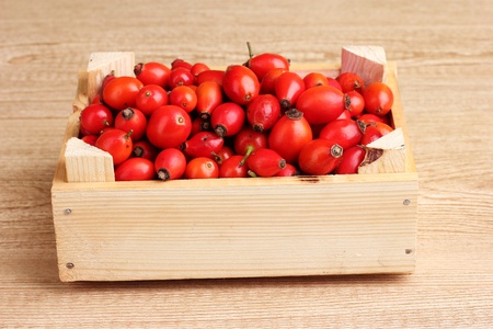ripe briar in wooden box on wooden table on wooden backgroundの写真素材