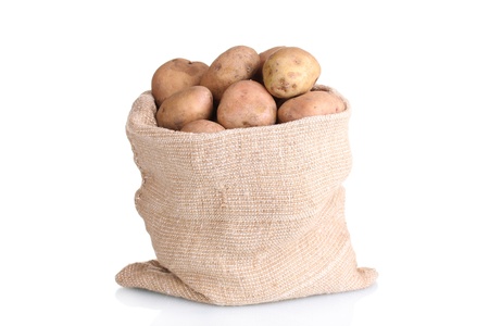 fresh potatoes in the bag isolated on whiteの写真素材