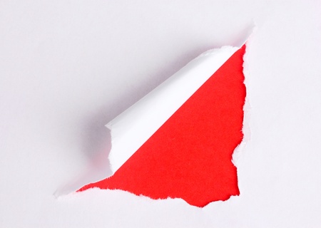 Torn paper  with red backgroundの写真素材