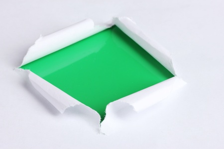 Torn paper  with green backgroundの写真素材
