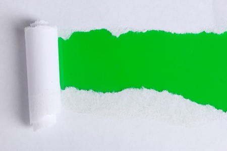 Torn paper  with green backgroundの写真素材