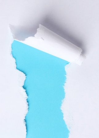 Torn paper  with blue backgroundの写真素材