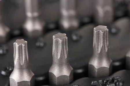 Construction bits on black closeup