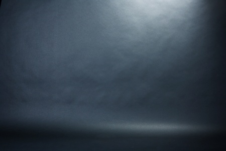 Spotlight studio interior, black backgroundの写真素材