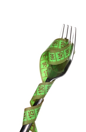 Fork and measuring tape isolated on whiteの写真素材