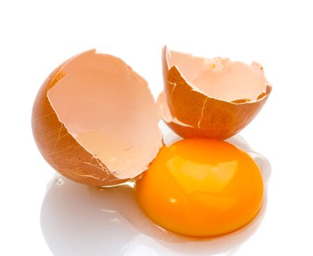 Brown egg with yolk isolated on white
