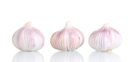 fresh garlic isolated on whiteの写真素材