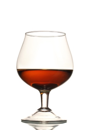Glass of cognac isolated on whiteの写真素材