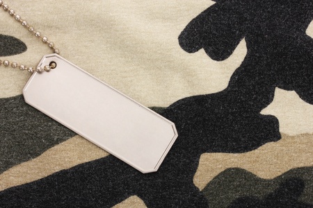 Army badges on camouflage backgroundの写真素材